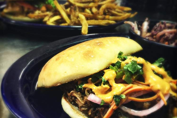 Plates of food from the Blue Duck Tavern in Peoria