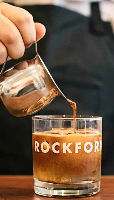 Person pouring coffee