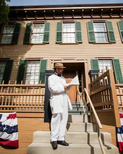 Man standing outside of home