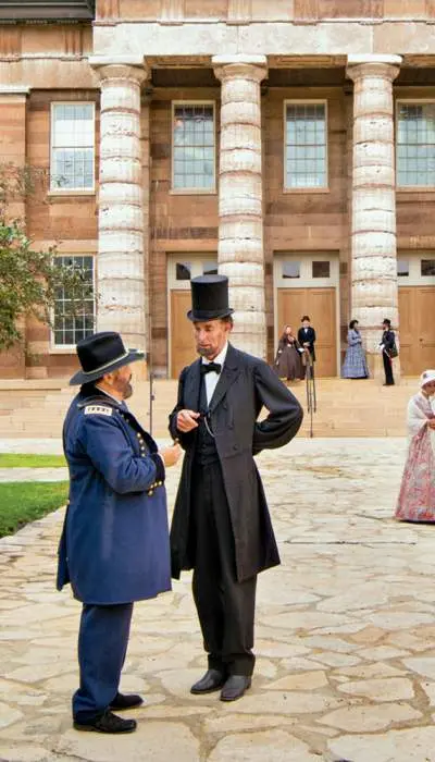 Lincoln in front of large building 