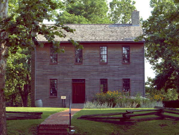 The exterior of a historic courthouse surrounded by trees