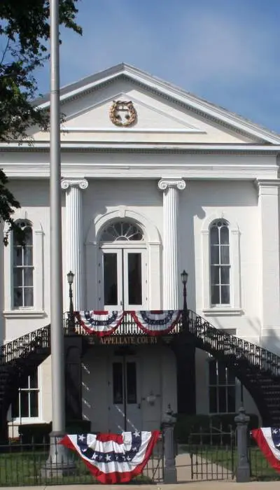 Exterior of 5th District Appellate Court with a Lincoln statue on the right side.