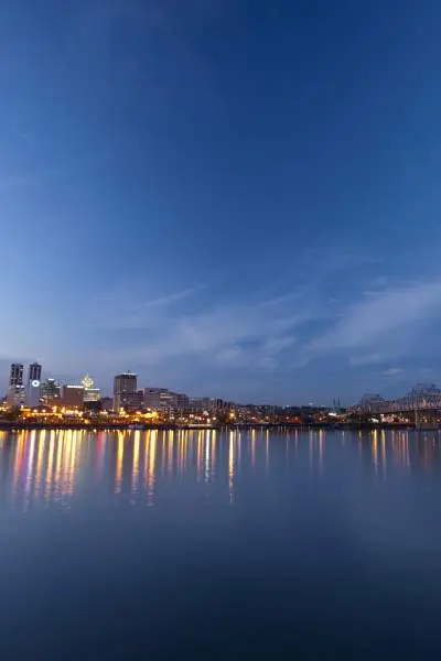 River with city and lights behind it