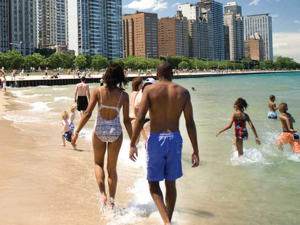 People walking down beach