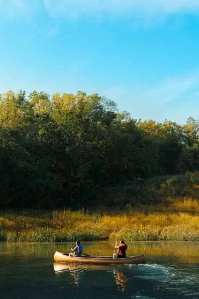 Two people in a canoe on a river