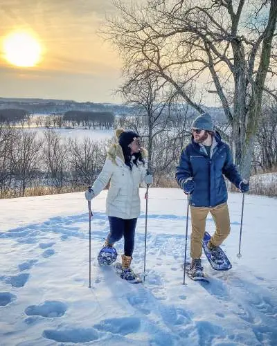 A Couple enjoying skiing.