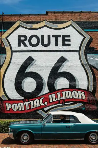 Route 66 Mural with a Pontiac car in front.