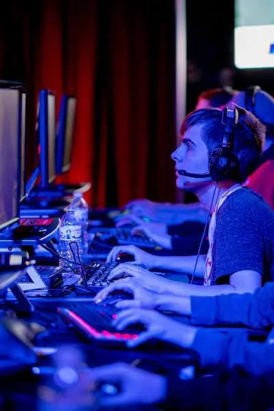 People on Computers competing in an esports tournament